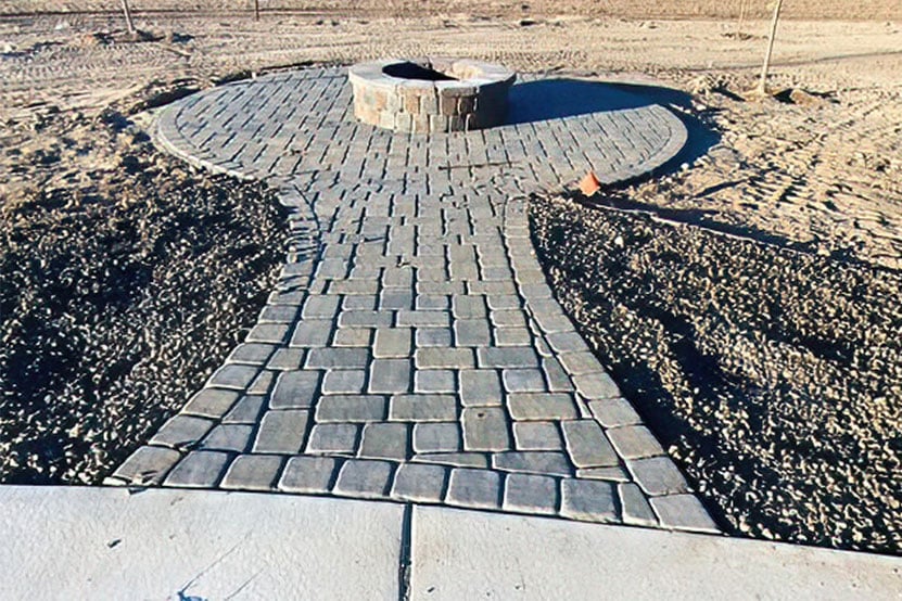 Outdoor fire pit with paver path by Palominos Landscaping services Caldwell Idaho