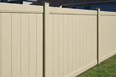 Tan vinyl fencing installed by Palominos Landscaping of Caldwell Idaho